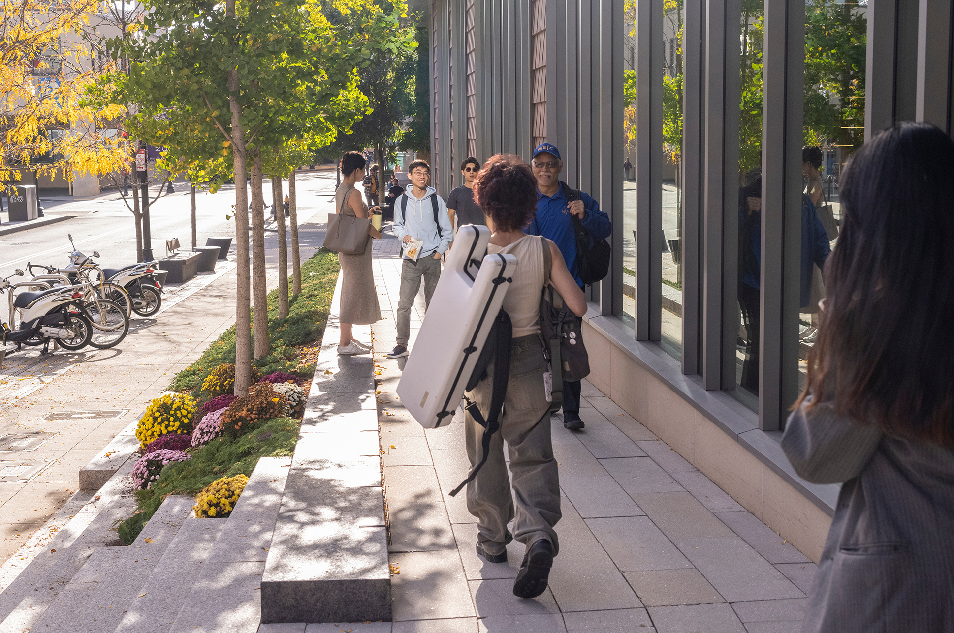 Students walking outside of the SLPC building at NEC.