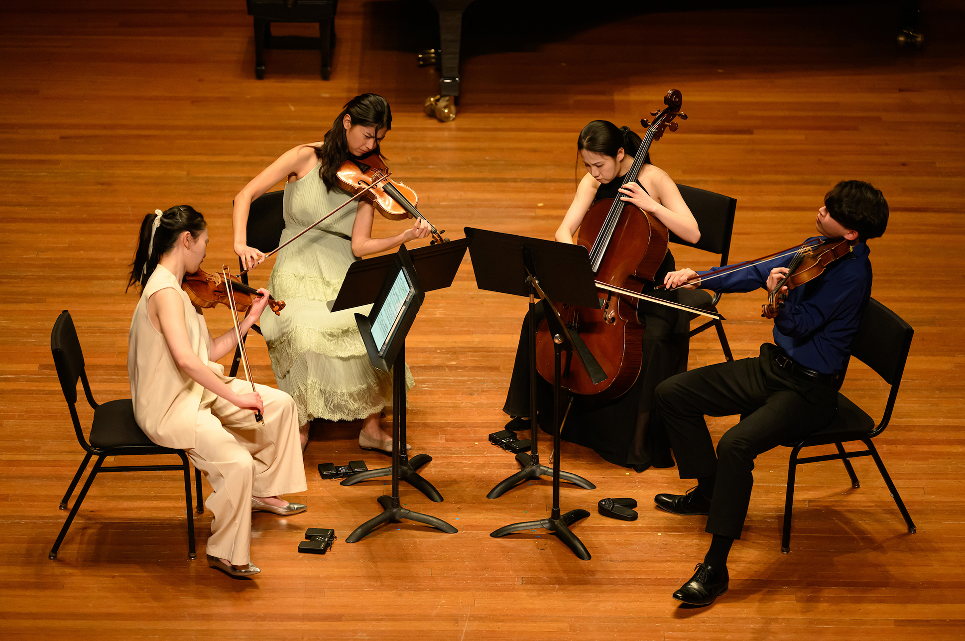 A string quartet performing on stage.