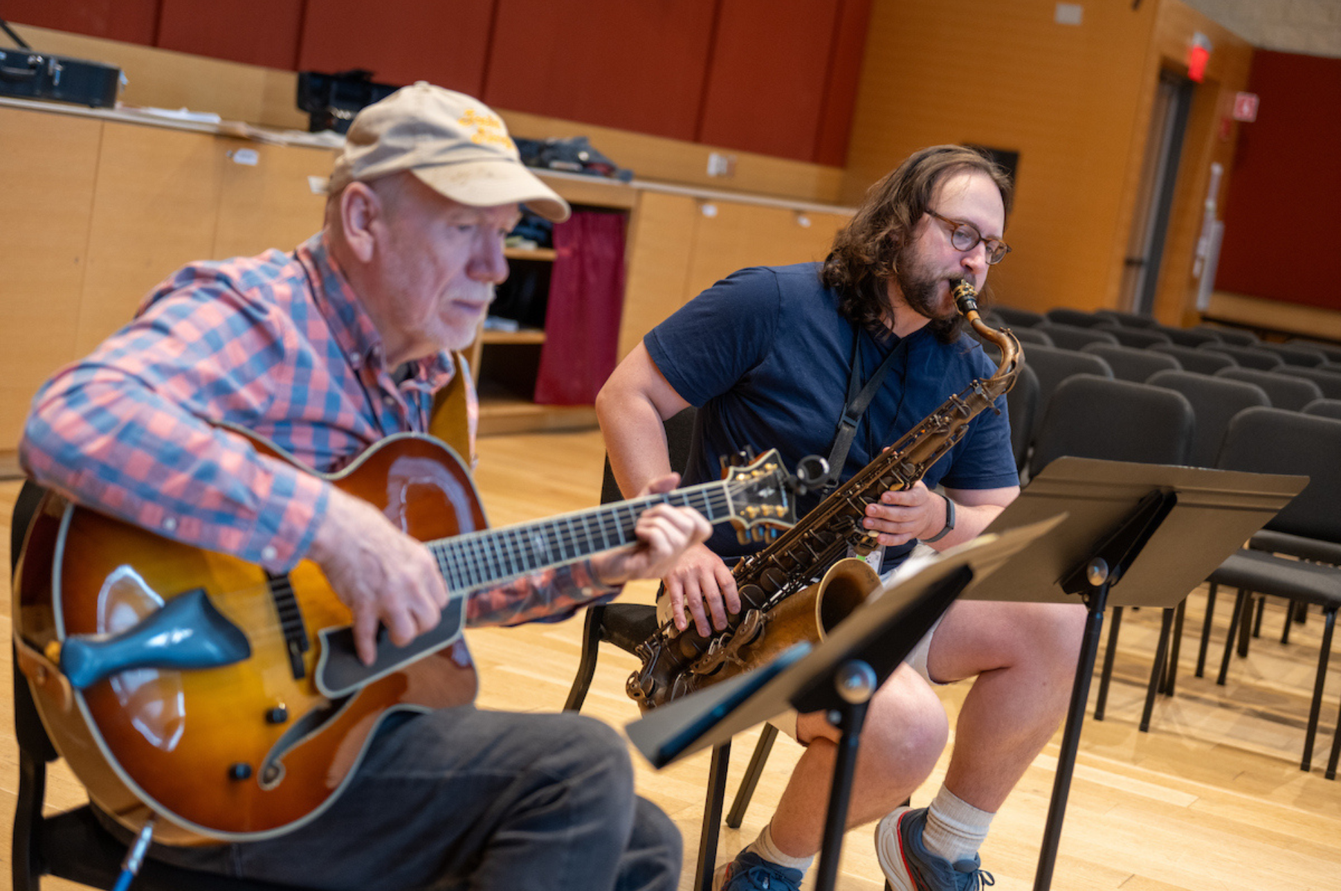 Adults jamming in a music session. 