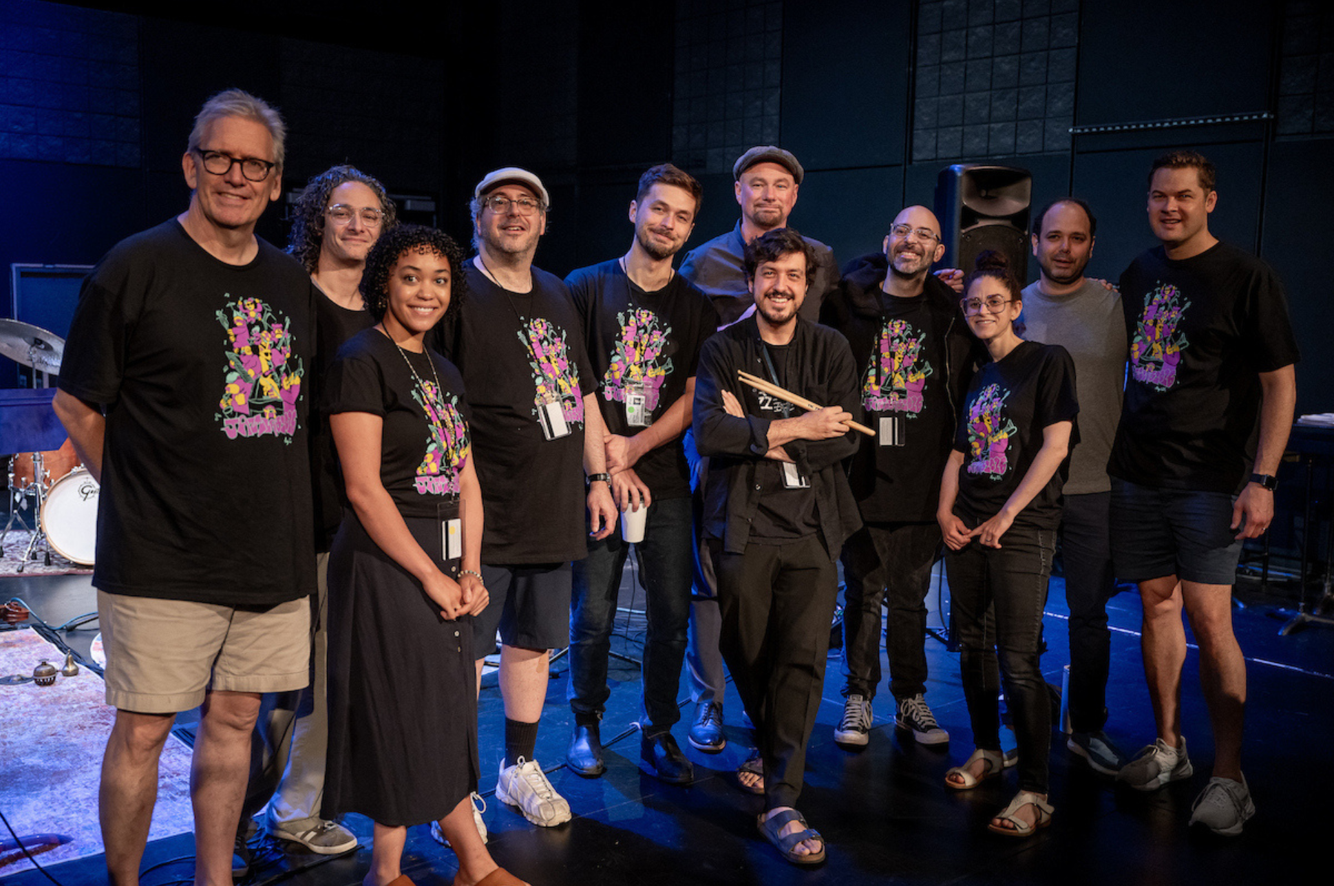 A group of jazz musicians smiling for the camera. 
