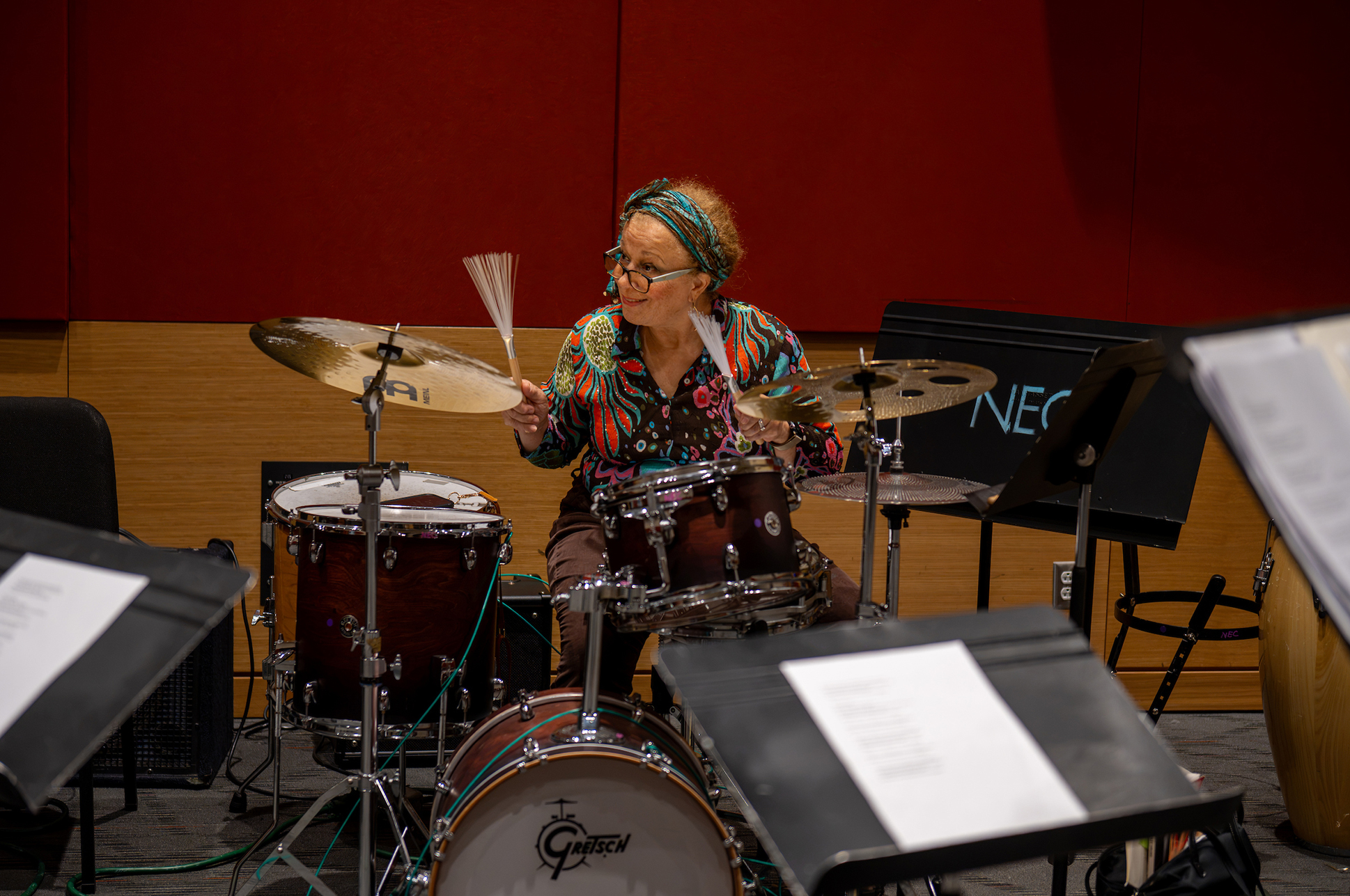 An adult music student playing the drums. An adult music student playing the drums.