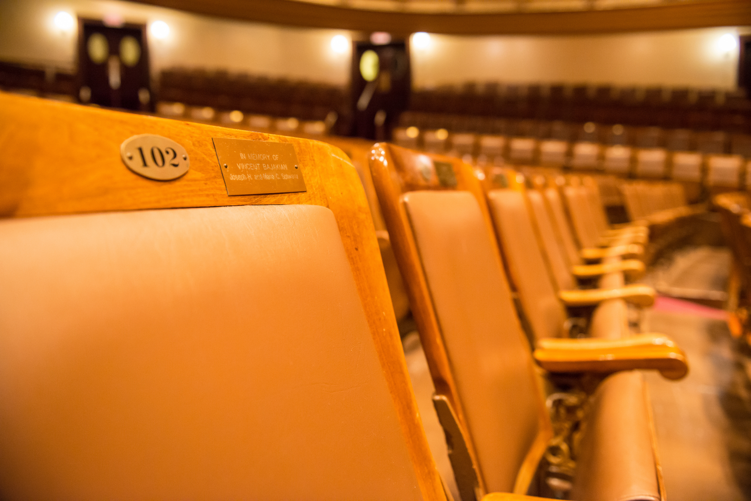 Closeup of a seat with a dedication plaque in Jordan Hall. Closeup of a seat with a dedication plaque in Jordan Hall.