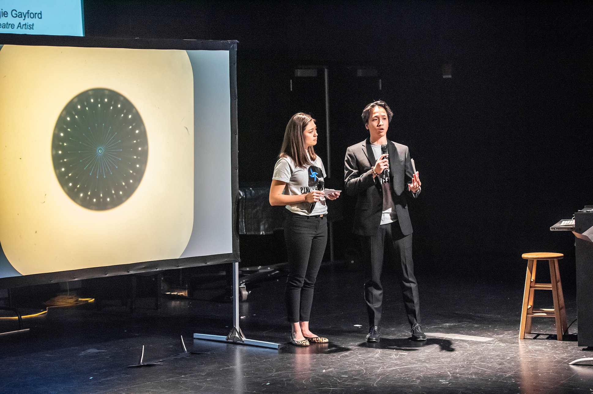 Two students presenting at a pitch competition.